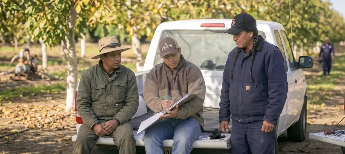 Supervisor leading a crew in the field